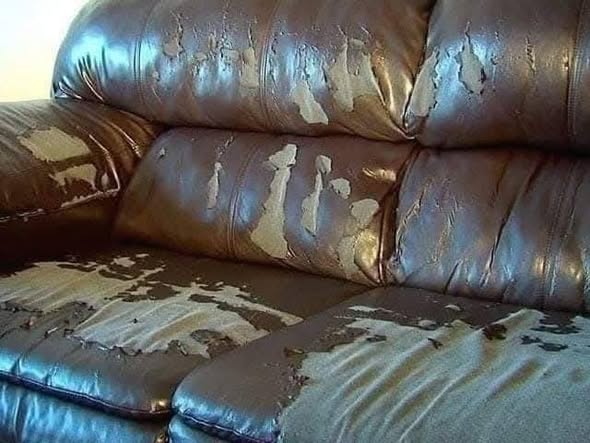 Worn sofa ready for reupholstery